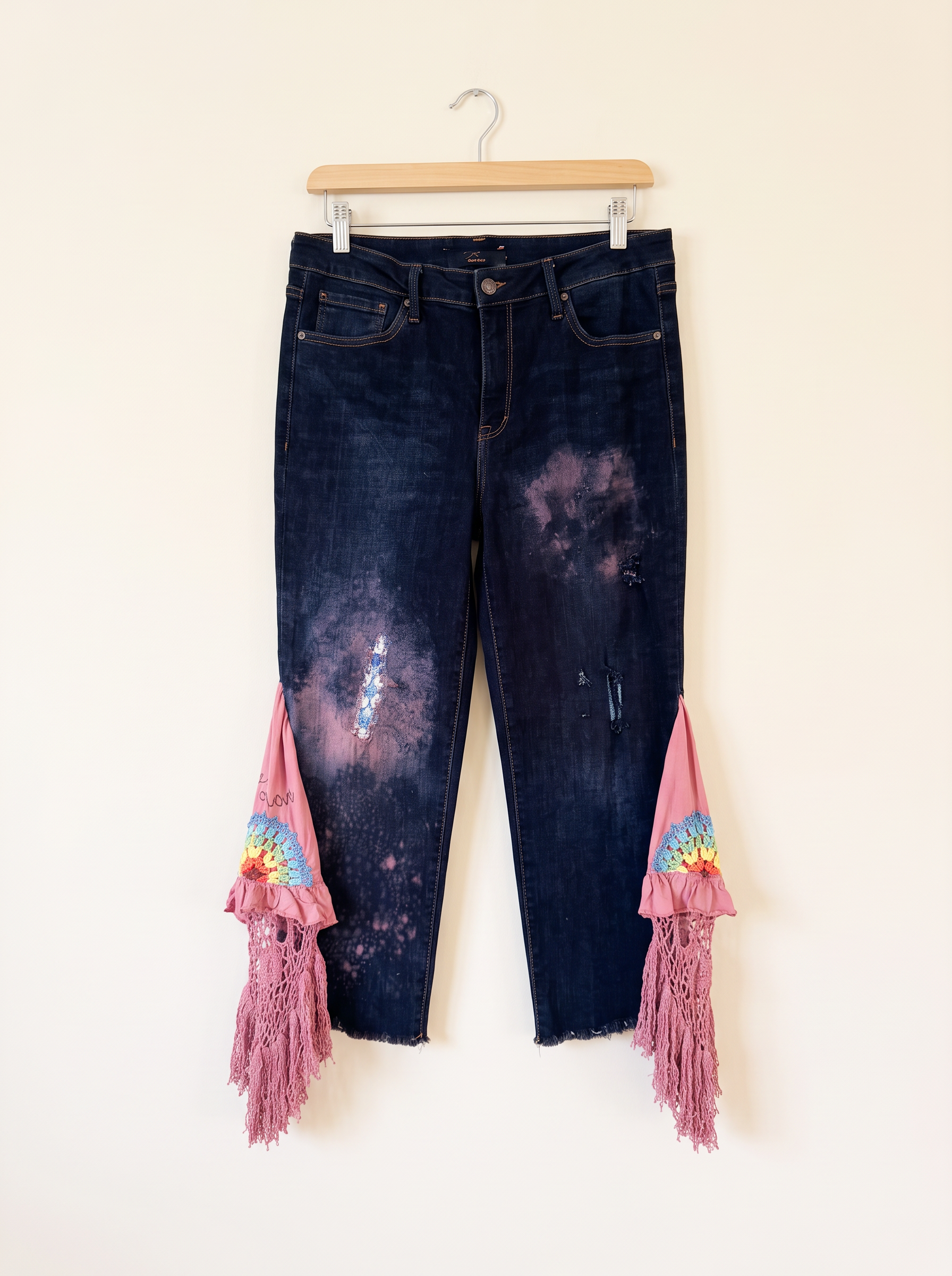 Dark denim with dusty-pink panels, rainbow crochet and tassel fringe — standalone boutique preview
